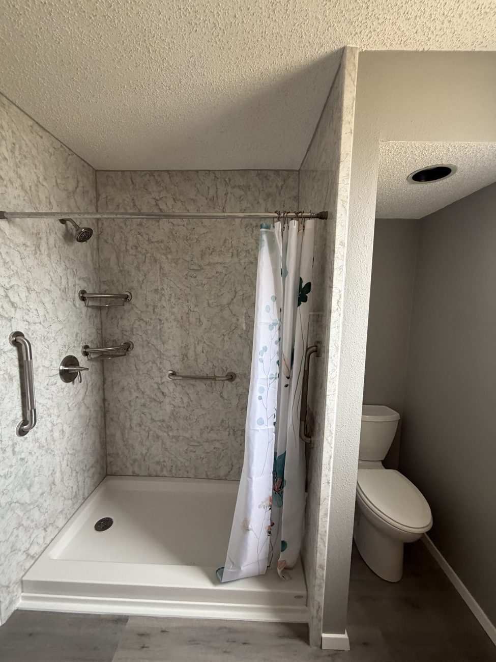 Marble-look shower with matte-black frame